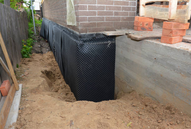 SJ Waterproofing Pros technician performing targeted Exterior Waterproofing assessment in Powell, AL